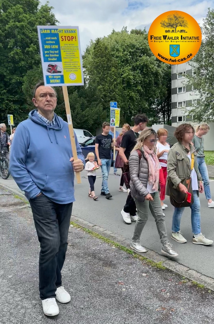 Foto: Demonstrant mit Plakat: Lärm macht krank